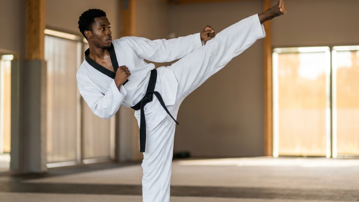 Taekwondo athlete executing a roundhouse kick